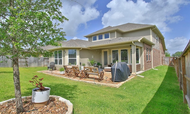 503 Highland Thicket Dr, Conroe, TX 77316 - rear view of house with a fenced backyard, a patio area, brick siding, and a shingled roof