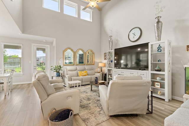 503 Highland Thicket Dr, Conroe, TX 77316 - living room with a towering ceiling, ceiling fan, and wood finished floors