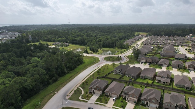 503 Highland Thicket Dr, Conroe, TX 77316 - aerial view of property and surrounding area featuring a heavily wooded area and nearby suburban area
