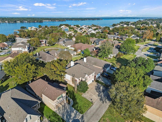 169 April Cv, Conroe, TX 77356 - aerial view of property and surrounding area with nearby suburban area and a large body of water