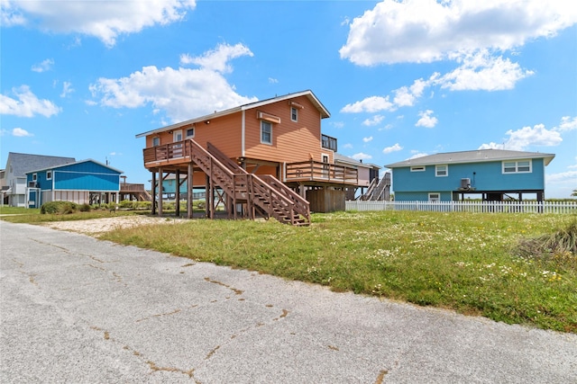 21216 Gulf Dr, Galveston, TX 77554 - back of property with stairs and a deck