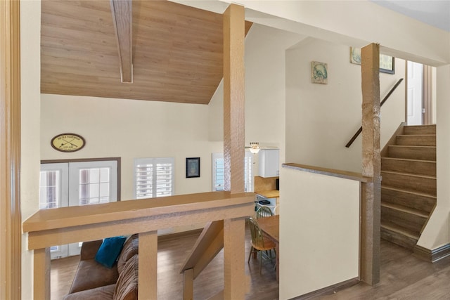 21216 Gulf Dr, Galveston, TX 77554 - staircase with wood finished floors and high vaulted ceiling