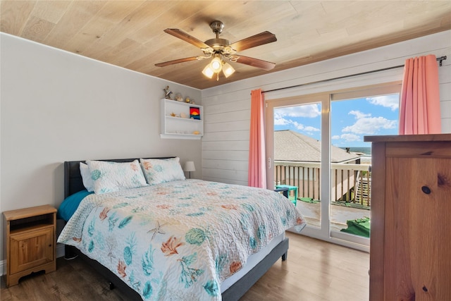 21216 Gulf Dr, Galveston, TX 77554 - bedroom with wooden ceiling, access to exterior, wood finished floors, and a ceiling fan