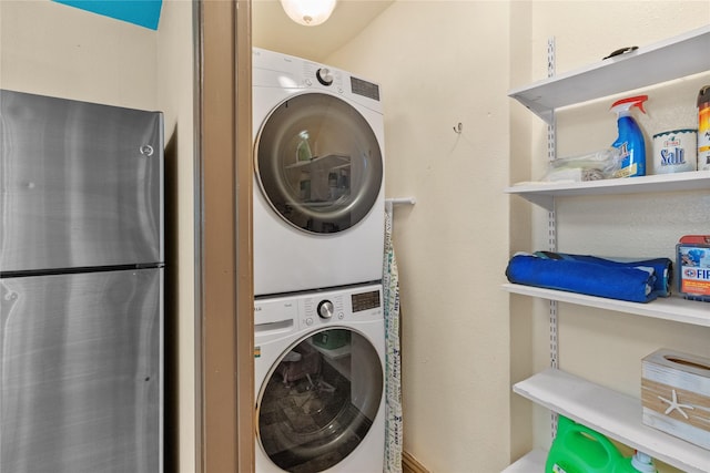 21216 Gulf Dr, Galveston, TX 77554 - washroom with stacked washing machine and dryer