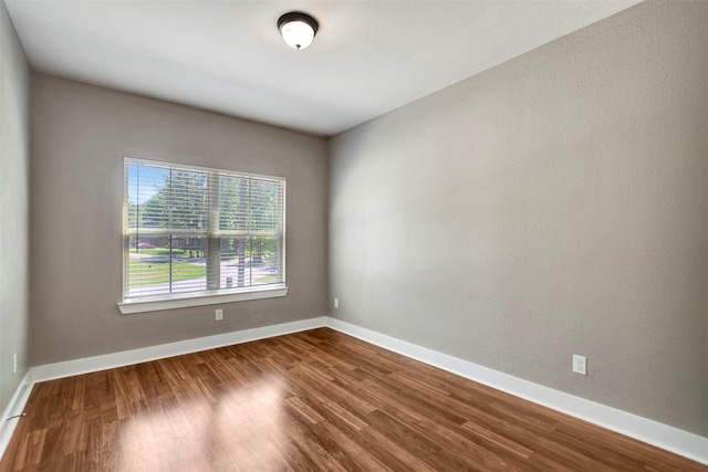 59 Beaconsfield Dr, Magnolia, TX 77355 - unfurnished room featuring wood finished floors and baseboards
