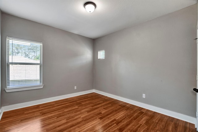 59 Beaconsfield Dr, Magnolia, TX 77355 - unfurnished room featuring wood finished floors and baseboards