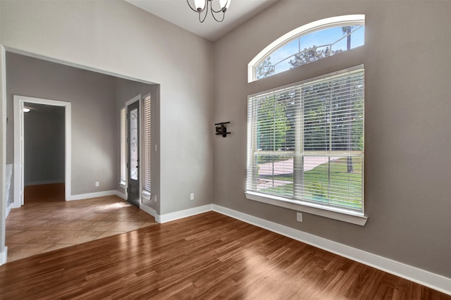 59 Beaconsfield Dr, Magnolia, TX 77355 - empty room featuring a chandelier and wood finished floors