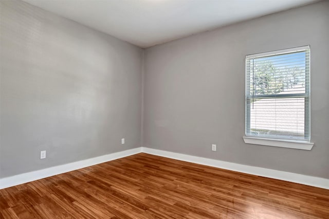 59 Beaconsfield Dr, Magnolia, TX 77355 - spare room with wood finished floors and baseboards