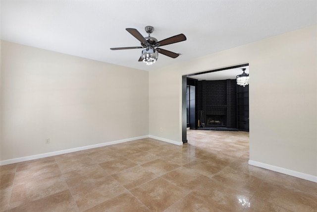 5 Cat Feet Ct, Spring, TX 77381 - unfurnished room featuring a ceiling fan, a large fireplace, and light tile patterned floors