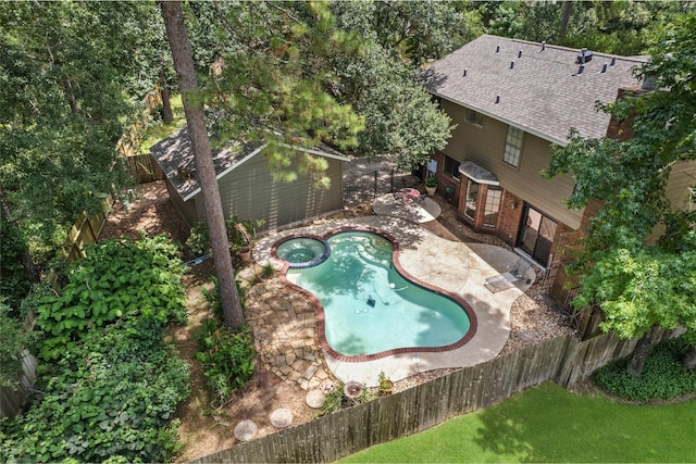 5 Cat Feet Ct, Spring, TX 77381 - view of pool featuring a fenced backyard, a patio, an outdoor structure, and a pool with connected hot tub