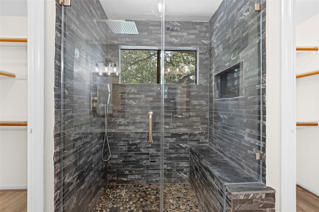 5 Cat Feet Ct, Spring, TX 77381 - full bath with a shower stall, a spacious closet, and wood finished floors
