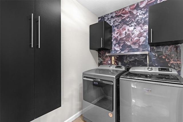 5 Cat Feet Ct, Spring, TX 77381 - laundry area with separate washer and dryer, cabinet space, wallpapered walls, and a textured ceiling