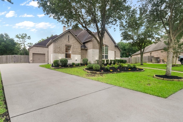 100 Anderson Ranch Ln, Friendswood, TX 77546 - french provincial home with brick siding, driveway, a chimney, and an attached garage