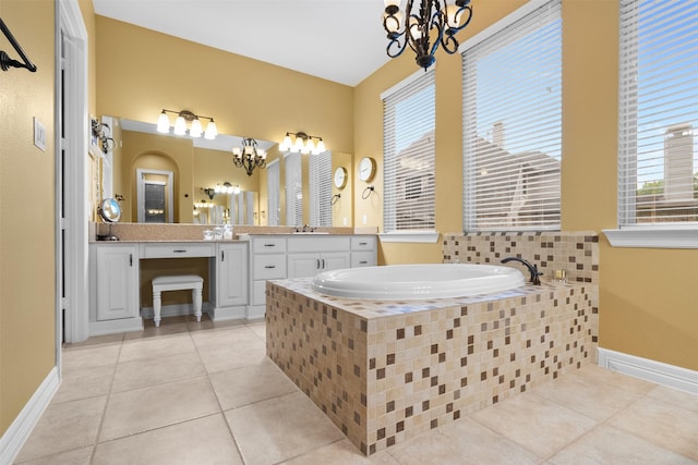 100 Anderson Ranch Ln, Friendswood, TX 77546 - full bath with a chandelier, tile patterned flooring, a garden tub, and vanity