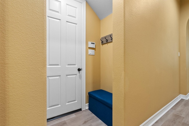 100 Anderson Ranch Ln, Friendswood, TX 77546 - mudroom featuring a textured wall and light wood-style flooring