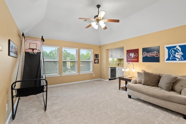 100 Anderson Ranch Ln, Friendswood, TX 77546 - living area featuring beverage cooler, a ceiling fan, vaulted ceiling, and light carpet