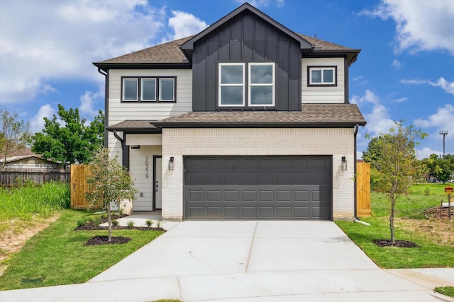 10219 Carmencita Way, Houston, TX 77075 - view of front facade featuring an attached garage, concrete driveway, brick siding, board and batten siding, and roof with shingles