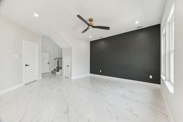 10219 Carmencita Way, Houston, TX 77075 - unfurnished room featuring a ceiling fan, stairway, light marble finish flooring, and recessed lighting