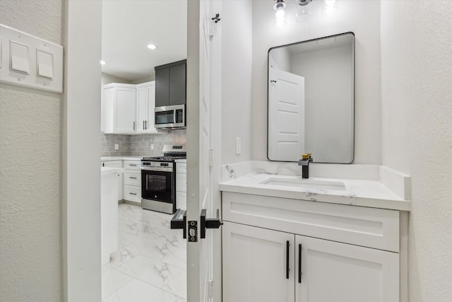 10219 Carmencita Way, Houston, TX 77075 - bathroom featuring marble look tiles, vanity, tasteful backsplash, a textured wall, and recessed lighting