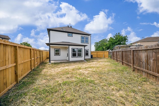 10219 Carmencita Way, Houston, TX 77075 - rear view of house with a fenced backyard and a patio