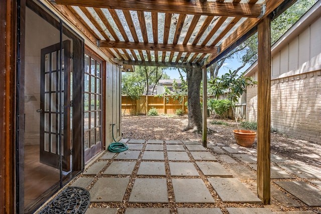 8020 Oakwood Forest Dr, Houston, TX 77040 - fenced backyard with a patio, a pergola, and french doors
