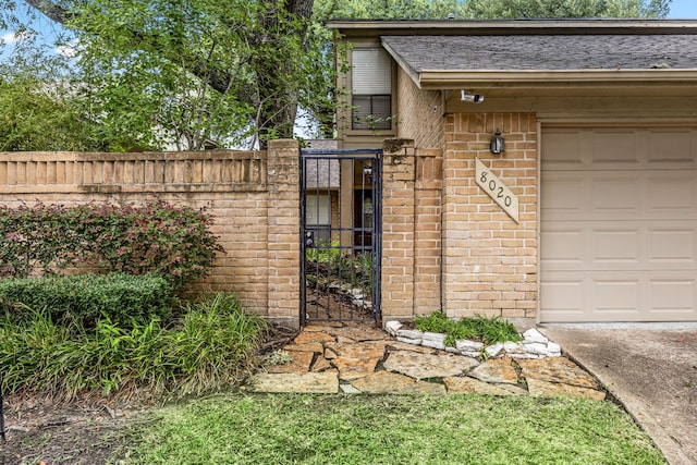 8020 Oakwood Forest Dr, Houston, TX 77040 - property entrance with a gate and brick siding