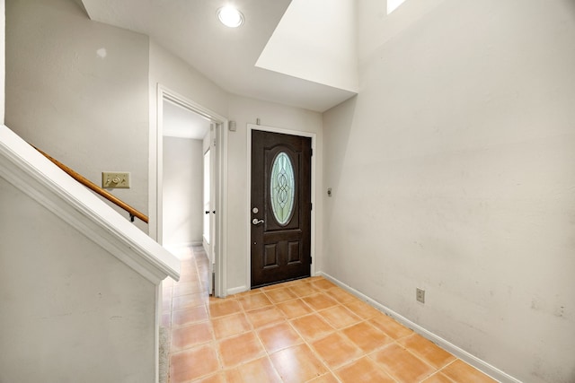 8020 Oakwood Forest Dr, Houston, TX 77040 - foyer entrance with light tile patterned floors and stairs
