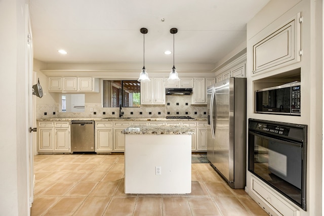 8020 Oakwood Forest Dr, Houston, TX 77040 - kitchen featuring stainless steel appliances, decorative backsplash, light stone counters, a center island, and recessed lighting