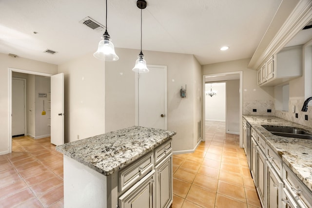 8020 Oakwood Forest Dr, Houston, TX 77040 - kitchen featuring light tile patterned floors, decorative light fixtures, a center island, recessed lighting, and light stone countertops