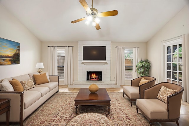 8020 Oakwood Forest Dr, Houston, TX 77040 - living area featuring vaulted ceiling, a ceiling fan, a fireplace, and light tile patterned floors