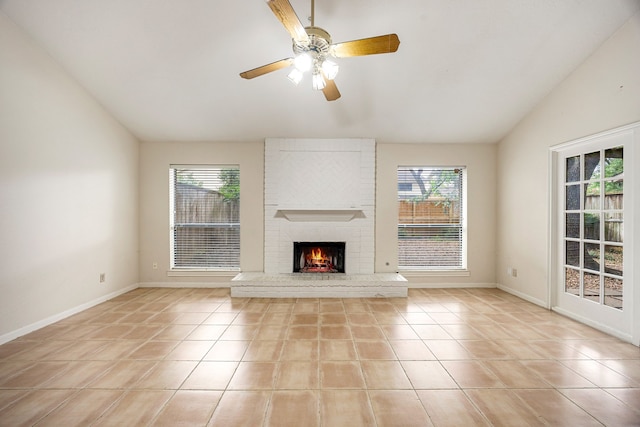 8020 Oakwood Forest Dr, Houston, TX 77040 - unfurnished living room with vaulted ceiling, healthy amount of natural light, light tile patterned floors, and a fireplace