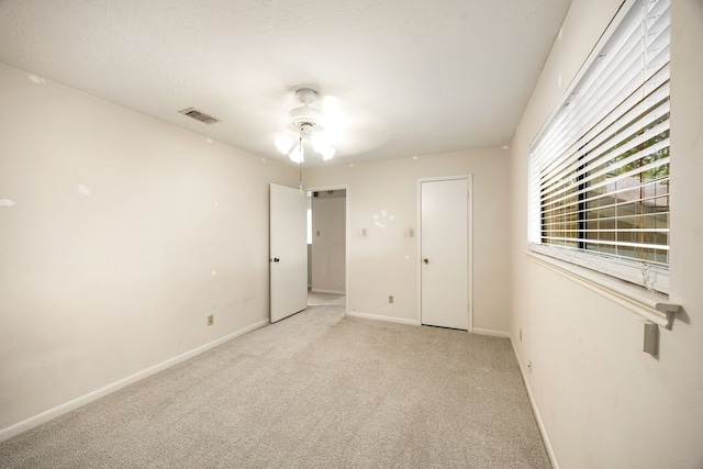 8020 Oakwood Forest Dr, Houston, TX 77040 - unfurnished bedroom with light carpet and ceiling fan