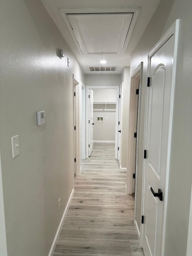 18468 Misty Wood Ln, Porter, TX 77365 - corridor with attic access and light wood-type flooring