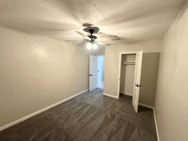 18468 Misty Wood Ln, Porter, TX 77365 - unfurnished bedroom featuring dark colored carpet, a textured ceiling, a closet, and a ceiling fan
