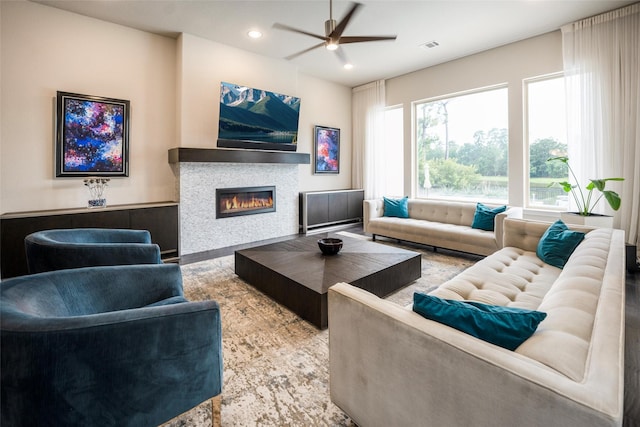 34207 Mill Creek Ct, Pinehurst, TX 77362 - living room with ceiling fan, a glass covered fireplace, and recessed lighting