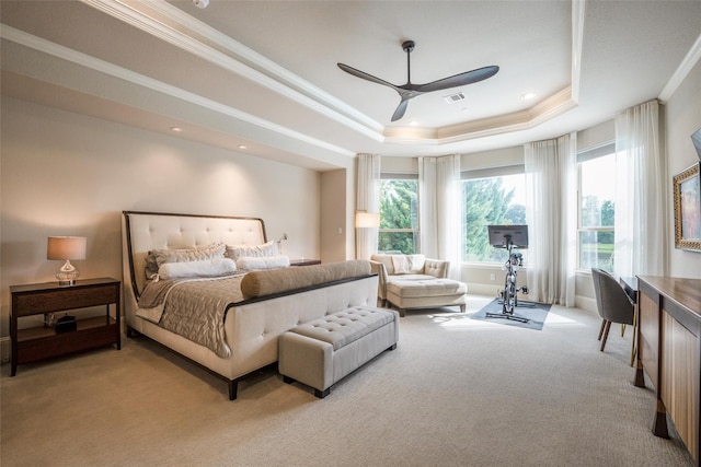34207 Mill Creek Ct, Pinehurst, TX 77362 - bedroom featuring a tray ceiling, multiple windows, carpet flooring, crown molding, and ceiling fan