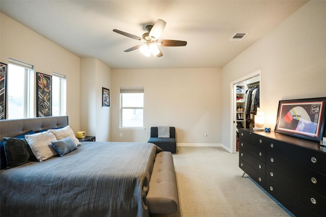34207 Mill Creek Ct, Pinehurst, TX 77362 - bedroom featuring light carpet, a walk in closet, and a ceiling fan