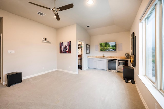 34207 Mill Creek Ct, Pinehurst, TX 77362 - living area with ceiling fan, light colored carpet, vaulted ceiling, and recessed lighting