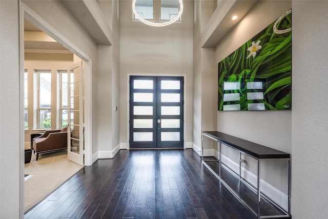 34207 Mill Creek Ct, Pinehurst, TX 77362 - foyer entrance with french doors and wood-type flooring