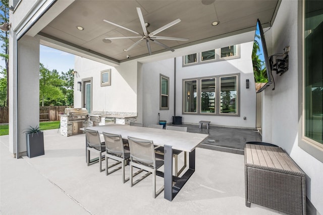 34207 Mill Creek Ct, Pinehurst, TX 77362 - view of patio with a ceiling fan, outdoor dining area, and an outdoor kitchen
