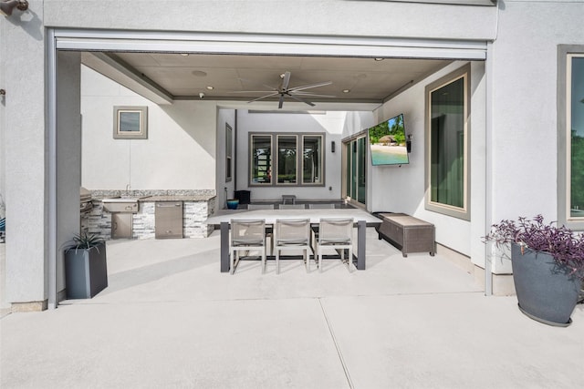 34207 Mill Creek Ct, Pinehurst, TX 77362 - view of patio / terrace with an outdoor kitchen, a ceiling fan, and outdoor dining space