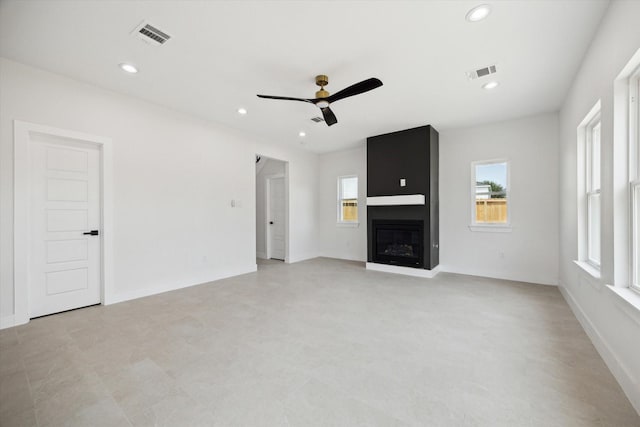 8614 Viera Ln, Houston, TX 77075 - unfurnished living room featuring healthy amount of natural light, a ceiling fan, a large fireplace, and recessed lighting