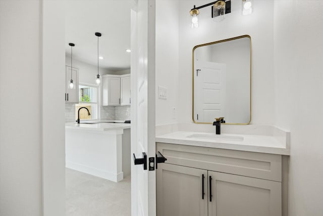 8614 Viera Ln, Houston, TX 77075 - bathroom with vanity, decorative backsplash, tile patterned floors, and recessed lighting