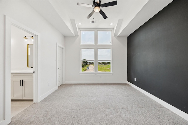 8614 Viera Ln, Houston, TX 77075 - unfurnished bedroom with light carpet, connected bathroom, recessed lighting, and ceiling fan