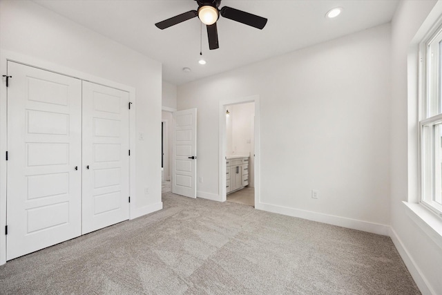 8614 Viera Ln, Houston, TX 77075 - unfurnished bedroom featuring light colored carpet, recessed lighting, a closet, ensuite bath, and a ceiling fan