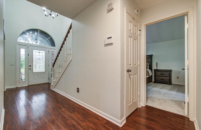 3411 Deeds Rd, Houston, TX 77084 - foyer entrance with dark wood finished floors, stairway, and a chandelier
