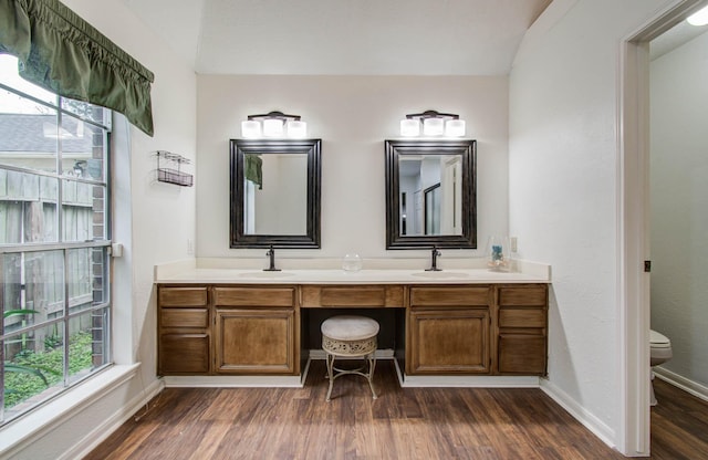 3411 Deeds Rd, Houston, TX 77084 - bathroom featuring wood finished floors and double vanity