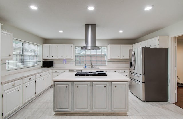 3411 Deeds Rd, Houston, TX 77084 - kitchen featuring stainless steel appliances, island exhaust hood, white cabinetry, light countertops, and recessed lighting