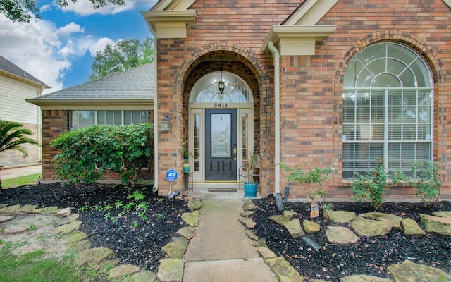 3411 Deeds Rd, Houston, TX 77084 - property entrance with brick siding and a shingled roof