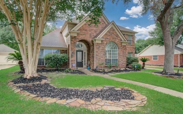 3411 Deeds Rd, Houston, TX 77084 - traditional-style house featuring brick siding and a front lawn